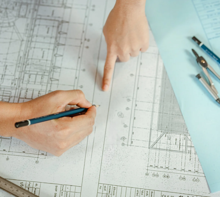 2 architects working together on a blueprint